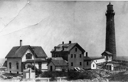 A black and white photo of houses in the 19th century.