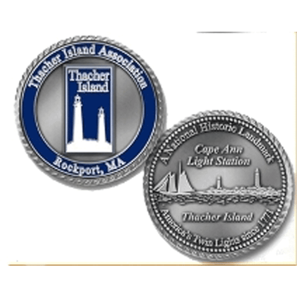 A silver coin with the image of a lighthouse on it.