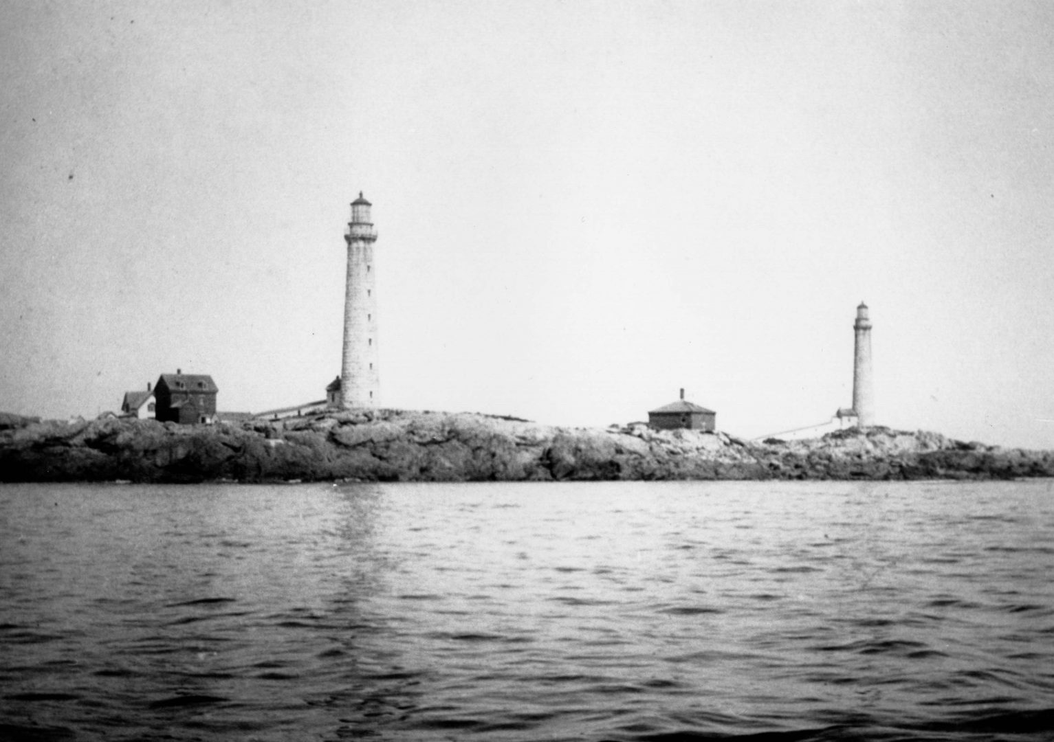 A black and white photo of three lighthouses.