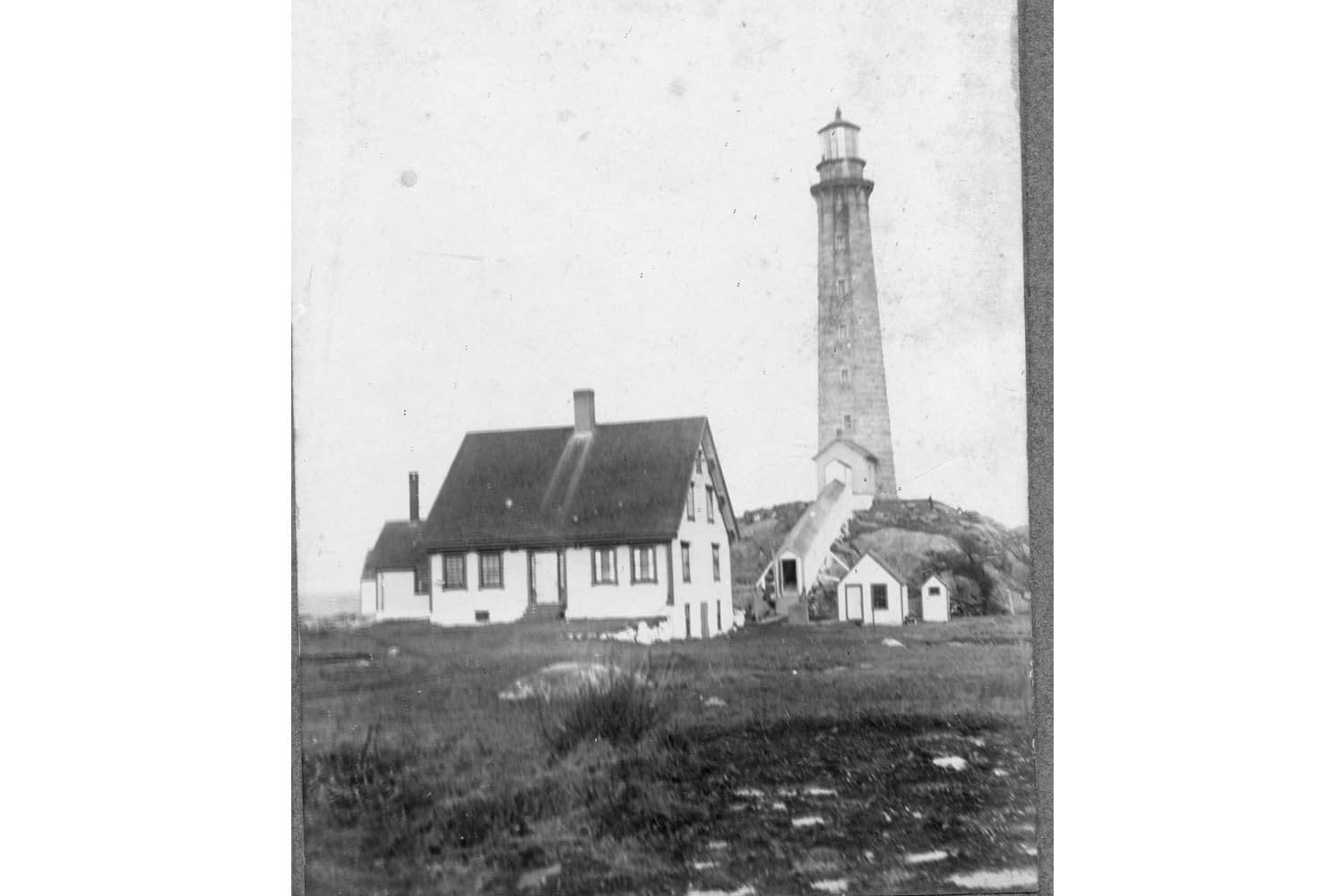 A black and white photo of a lighthouse.